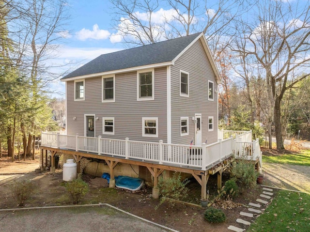 rear view of property with a deck