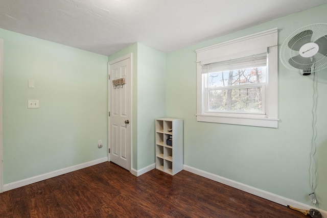 unfurnished room with dark hardwood / wood-style floors