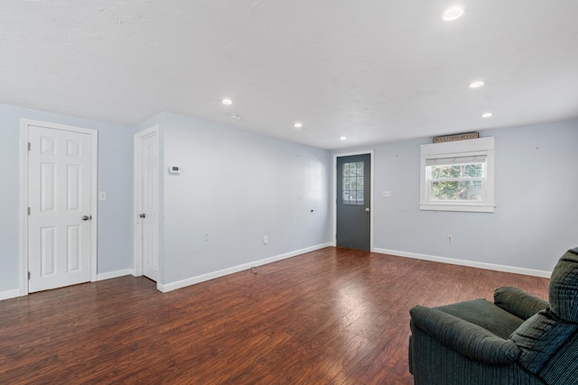 living room featuring dark wood-type flooring