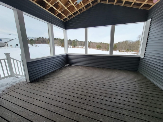 unfurnished sunroom with vaulted ceiling and a healthy amount of sunlight