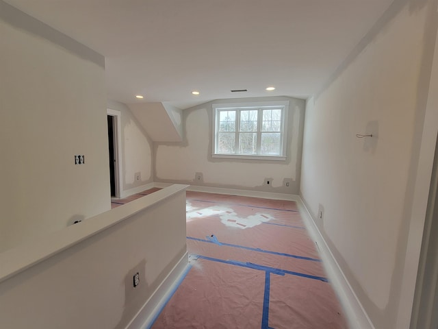 additional living space with vaulted ceiling