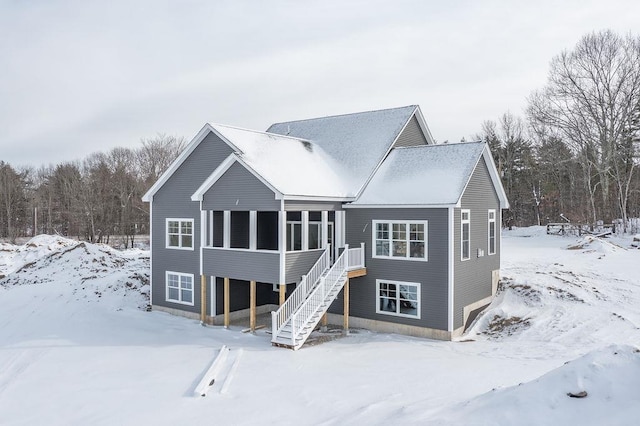 view of front of house featuring a sunroom