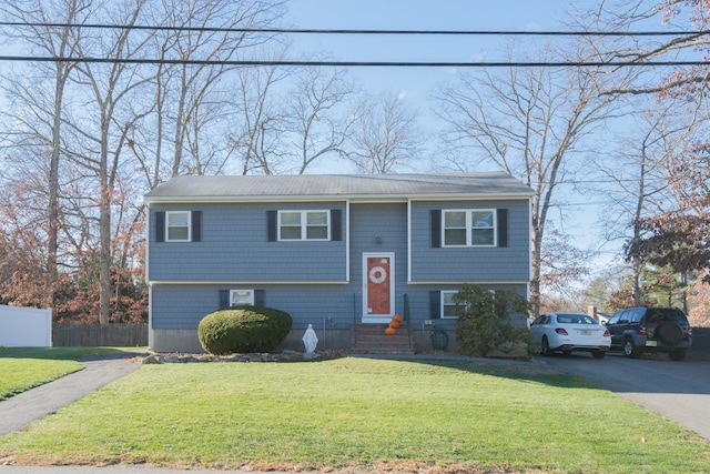 bi-level home with a front yard