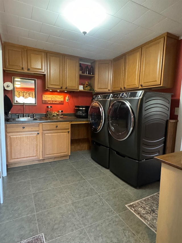 laundry room with separate washer and dryer, sink, and light tile patterned floors