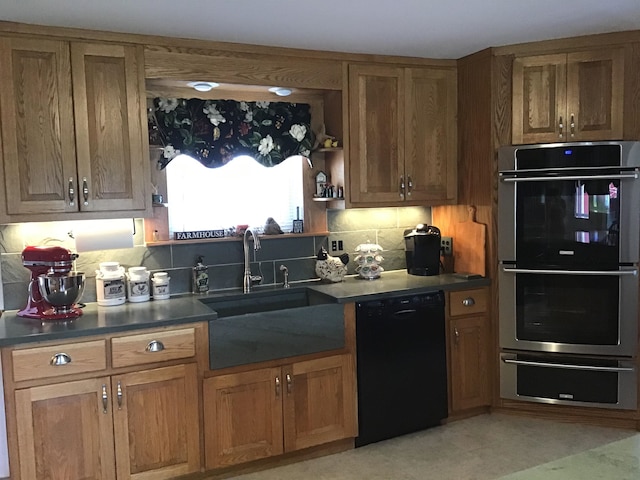 kitchen with dishwasher, sink, double oven, and tasteful backsplash