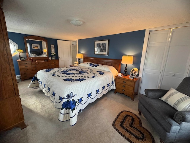 carpeted bedroom with a textured ceiling