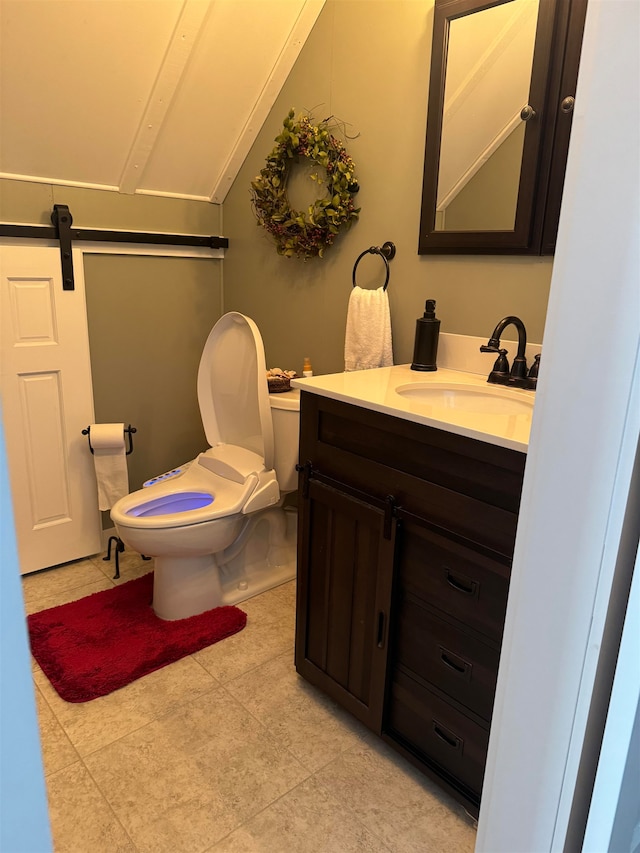 bathroom with tile patterned floors, vanity, and toilet