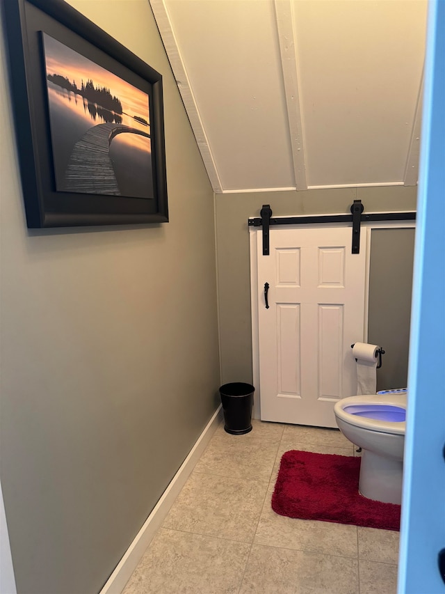 bathroom with tile patterned flooring and toilet