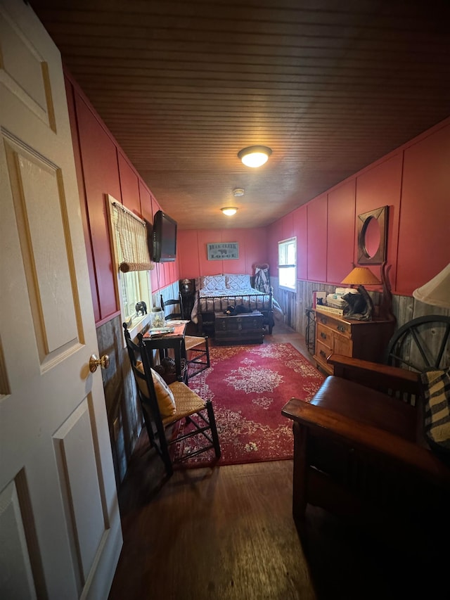 bedroom with dark hardwood / wood-style flooring