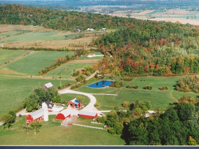 birds eye view of property featuring a rural view and a water view