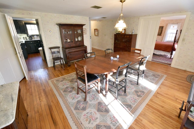 dining room featuring hardwood / wood-style floors and a wealth of natural light