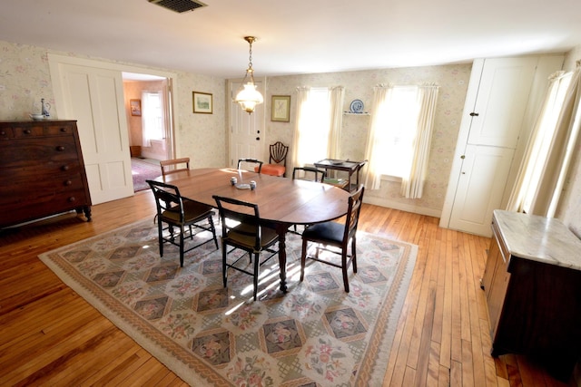 dining area with light wood-type flooring