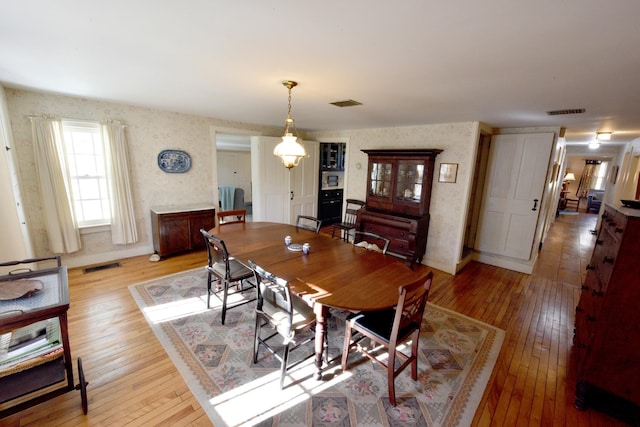 dining room with light hardwood / wood-style flooring