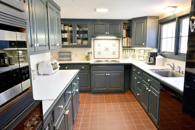 kitchen featuring gray cabinets, sink, and black appliances