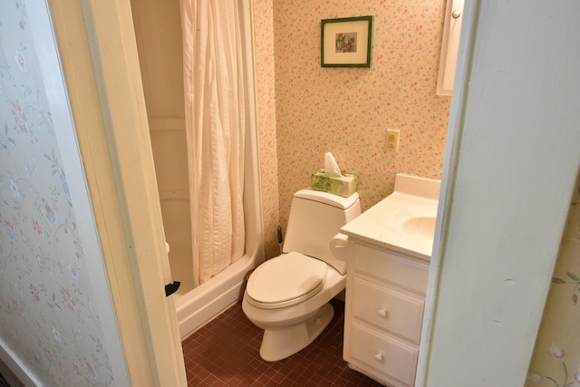 bathroom with a shower with curtain, tile patterned flooring, vanity, and toilet