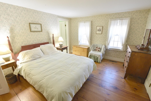 bedroom with light wood-type flooring