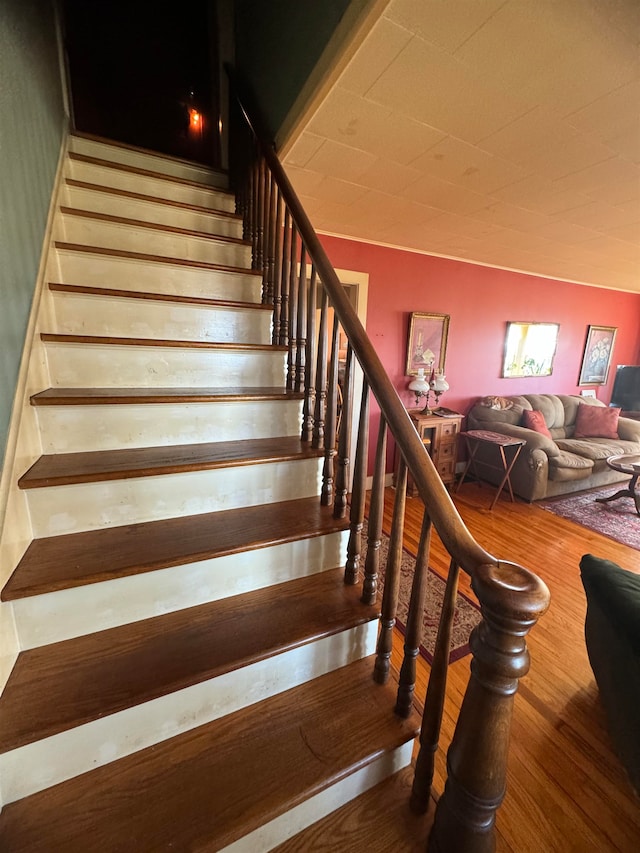 stairway featuring hardwood / wood-style floors