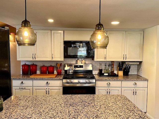 kitchen with pendant lighting, black appliances, tasteful backsplash, stone countertops, and white cabinetry