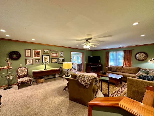 carpeted living room with ceiling fan and crown molding