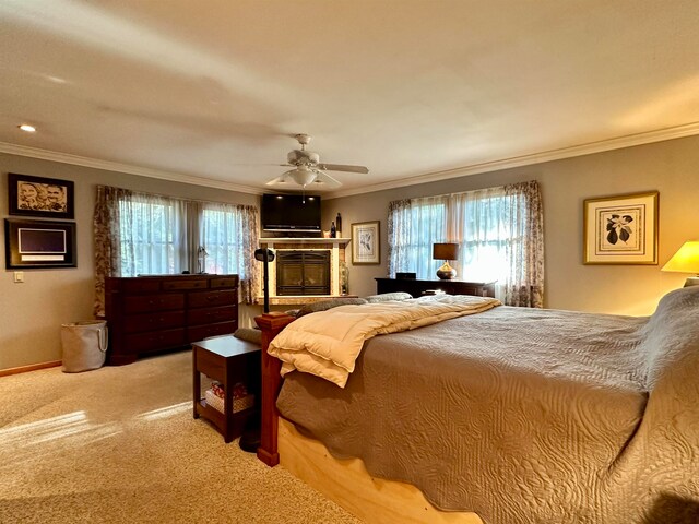 bedroom featuring carpet flooring, ceiling fan, and crown molding