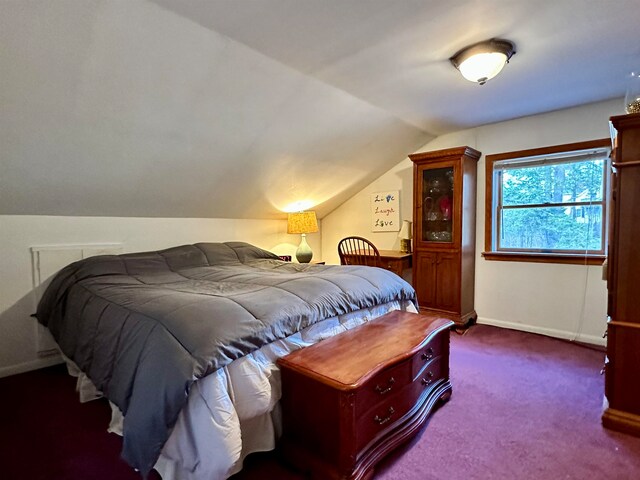 carpeted bedroom with vaulted ceiling