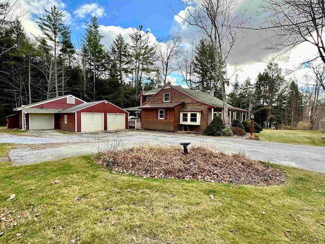 exterior space featuring a yard and a garage