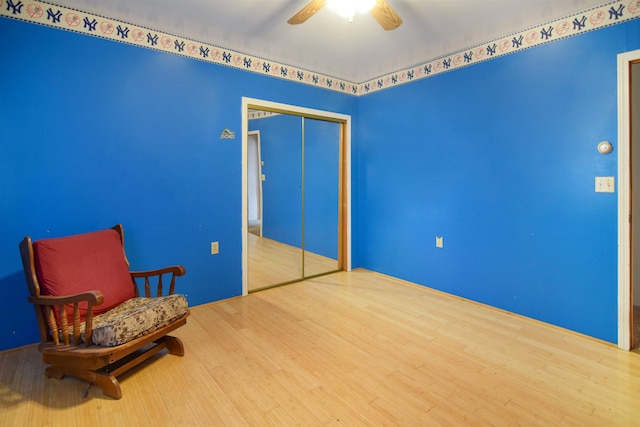 unfurnished room featuring hardwood / wood-style floors and ceiling fan