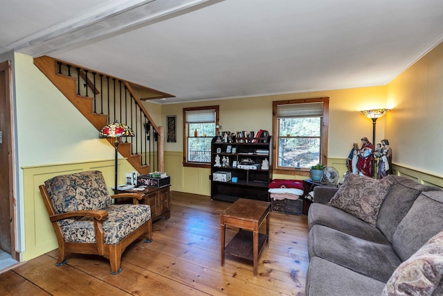 living room featuring hardwood / wood-style flooring and ornamental molding