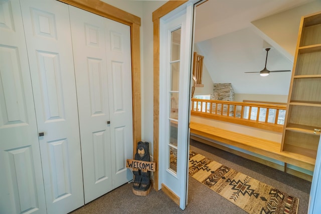 interior space with carpet floors and lofted ceiling