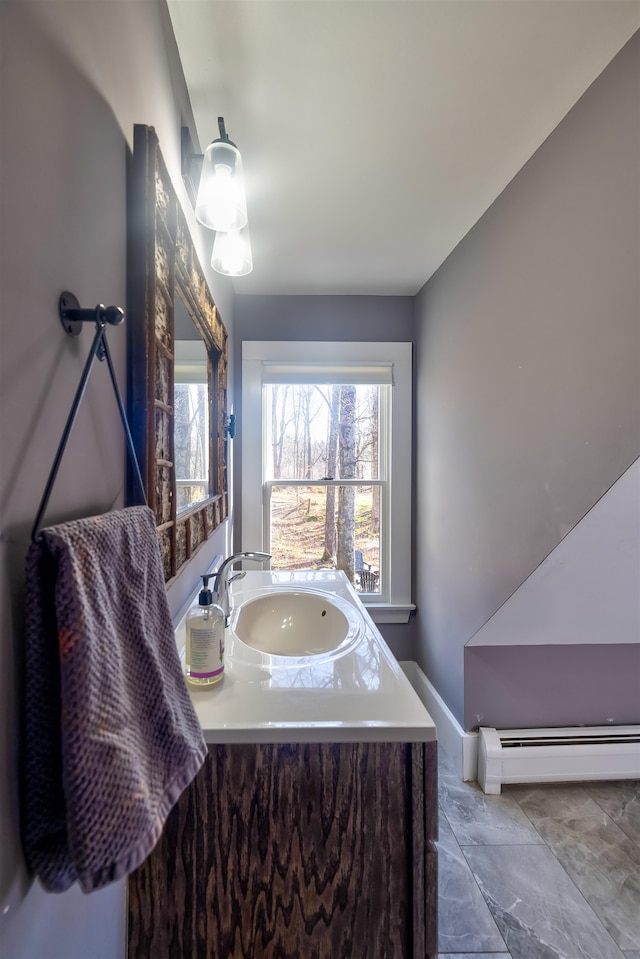 bathroom featuring vanity and baseboard heating