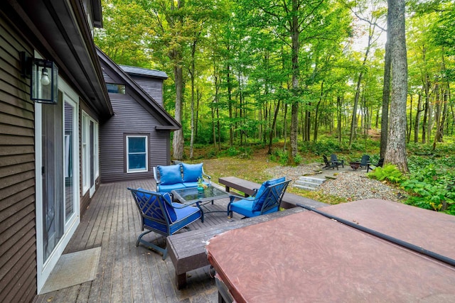 view of patio featuring outdoor lounge area and a wooden deck