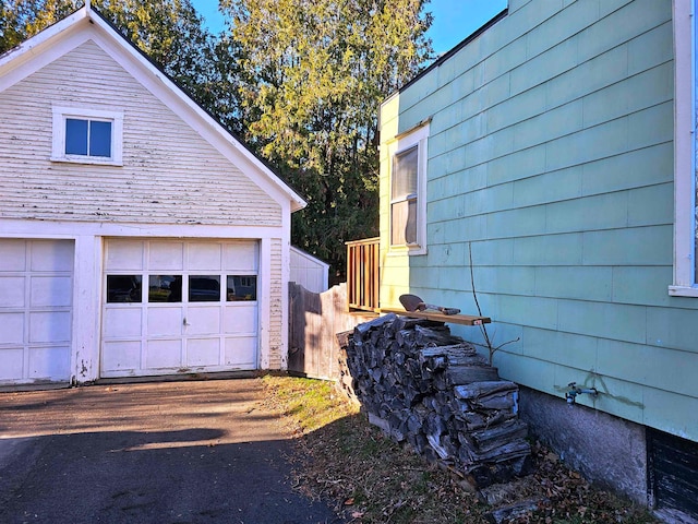 view of side of home featuring a garage