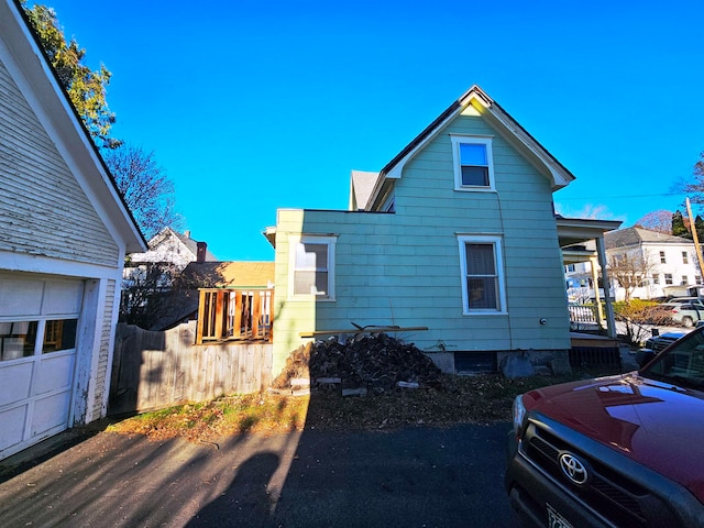 view of side of property with a garage