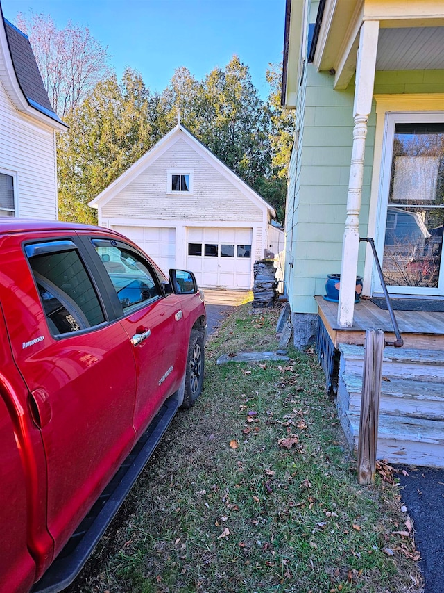 view of side of home with an outbuilding and a garage