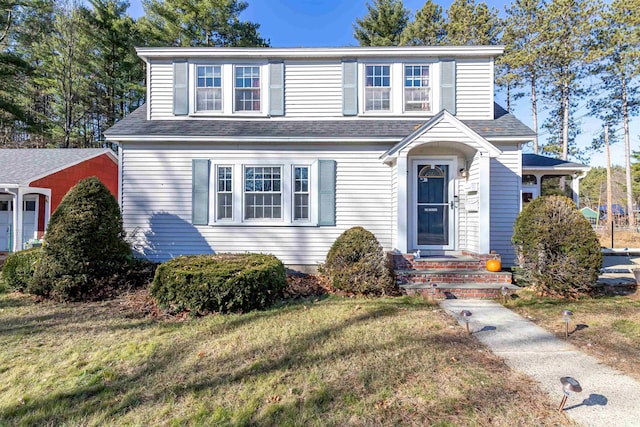 view of front of property with a front lawn