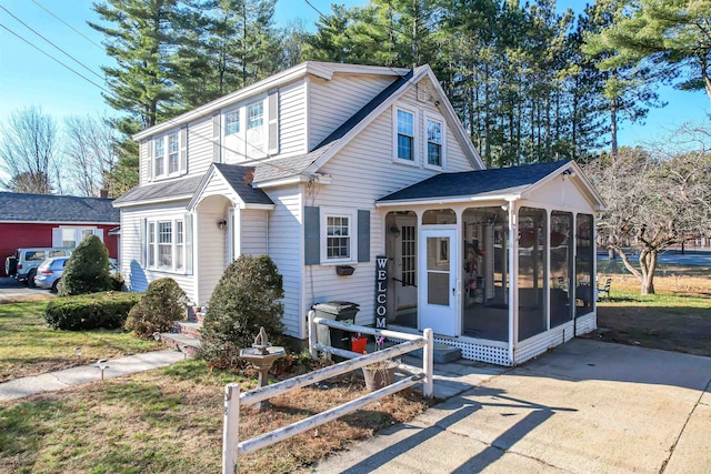 view of front facade with a sunroom