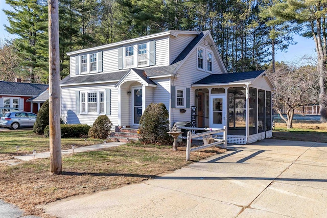 view of front of property featuring a sunroom