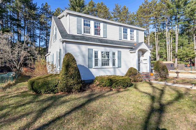 front facade with a front yard