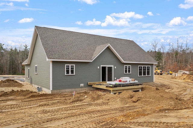 back of house with a wooden deck and central AC unit