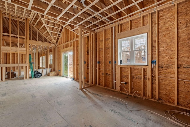 miscellaneous room featuring lofted ceiling