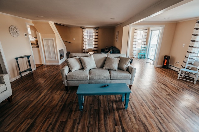 living room with dark hardwood / wood-style flooring, ornamental molding, and a baseboard radiator