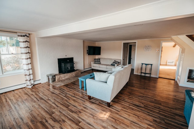 living room featuring baseboard heating, a fireplace, and dark wood-type flooring