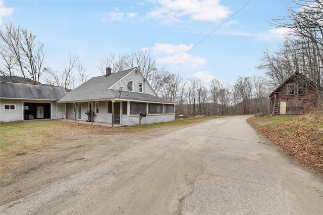 view of home's exterior featuring covered porch and central AC unit