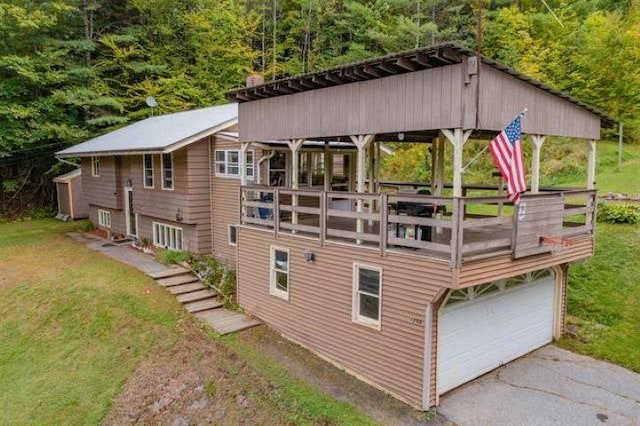 back of property with a garage