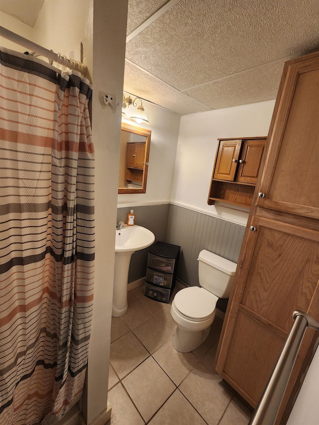 bathroom featuring tile patterned floors and toilet