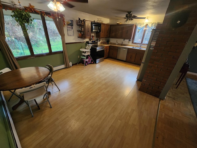 kitchen with ceiling fan, appliances with stainless steel finishes, and light wood-type flooring