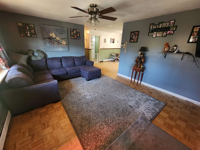 living room featuring parquet floors and ceiling fan