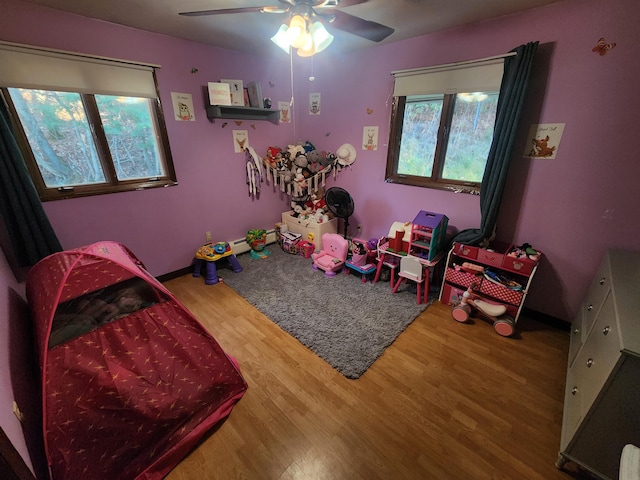 game room featuring ceiling fan and wood-type flooring