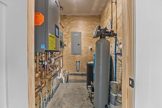 utility room featuring tankless water heater and electric panel