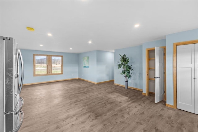 unfurnished living room with light wood-type flooring